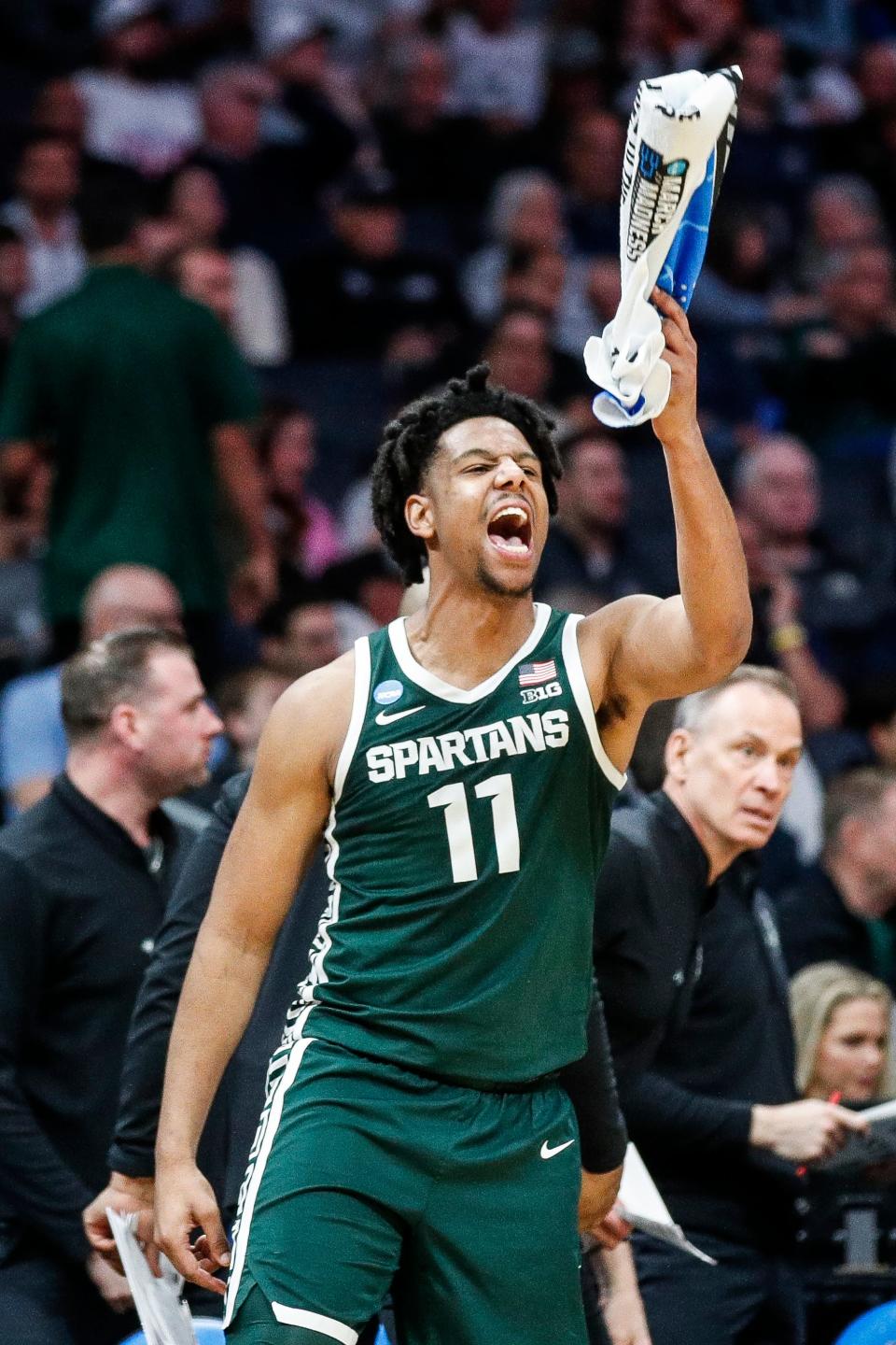 Michigan State guard AJ Hoggard (11) celebrates a play against Mississippi State on the bench during the second half of the first round of the NCAA Tournament West Region at the Spectrum Center in Charlotte, NC on Thursday , March 21, 2024.