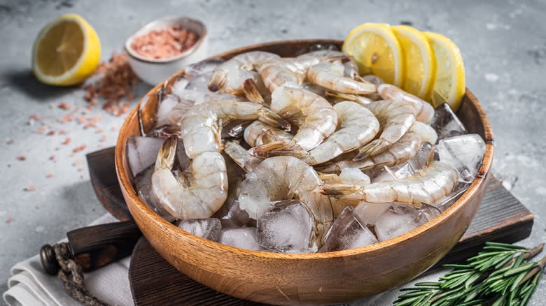 Peeled shrimp in a bowl with lemon