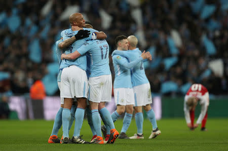 Soccer Football - Carabao Cup Final - Arsenal vs Manchester City - Wembley Stadium, London, Britain - February 25, 2018 Manchester City's Vincent Kompany celebrates with teammates after the match Action Images via Reuters/Peter Cziborra