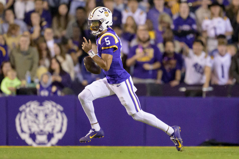 LSU quarterback Jayden Daniels (5) runs during the first half of an NCAA college football game against Georgia State in Baton Rouge, La., Saturday, Nov. 18, 2023. (AP Photo/Matthew Hinton)