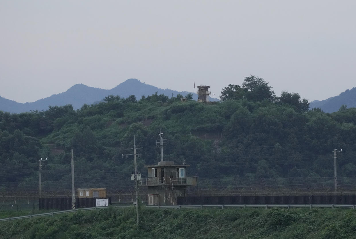 A North Korean military guard post, rear, and South Korea post, bottom, are seen in Paju near the border with North Korea, South Korea, Tuesday, July 18, 2023. An American has crossed the heavily fortified border from South Korea into North Korea, the American-led U.N. Command overseeing the area said Tuesday, amid heightened tensions over North Korea's nuclear program. (AP Photo/Ahn Young-joon)