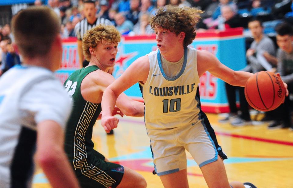 Louisville's Tate Aljancic handles the ball in a Division I district semifinal against Medina, Wednesday, March 6, 2024 at Alliance High School.