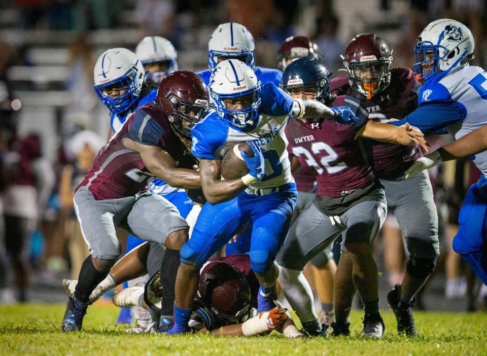 Pahokee running back Jenorris Wilcher Jr., runs the ball against Dwyer in Palm Beach Gardens, Florida on September 29, 2023.