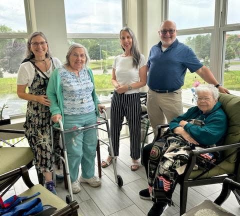 From left: Deborah, Leila, and Michael Lisman visit their cousins Jan, standing, and Dorothy, seated, at the Jewish Home in the summer of 2023.