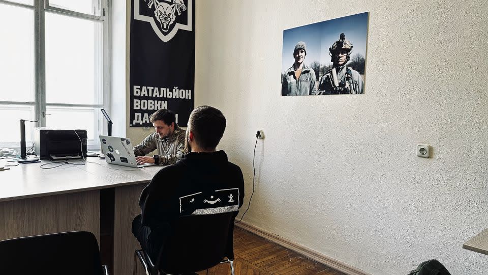 A potential new recruit is being interviewed at the Da Vinci Wolves Battalion’s recruitment office in Kyiv in May 2024. - Daria Tarasova-Markina/CNN