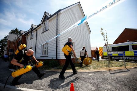 Fire and Rescue Service personel arrive with safety equipment at the site of a housing estate on Muggleton Road, after it was confirmed that two people had been poisoned with the nerve-agent Novichok, in Amesbury, Britain, July 6, 2018. REUTERS/Henry Nicholls/Files