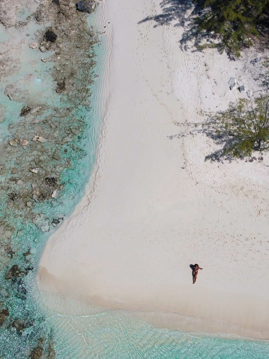 Patel pictured lying on a beach in the Bahamas. (Christina Patel/SWNS)