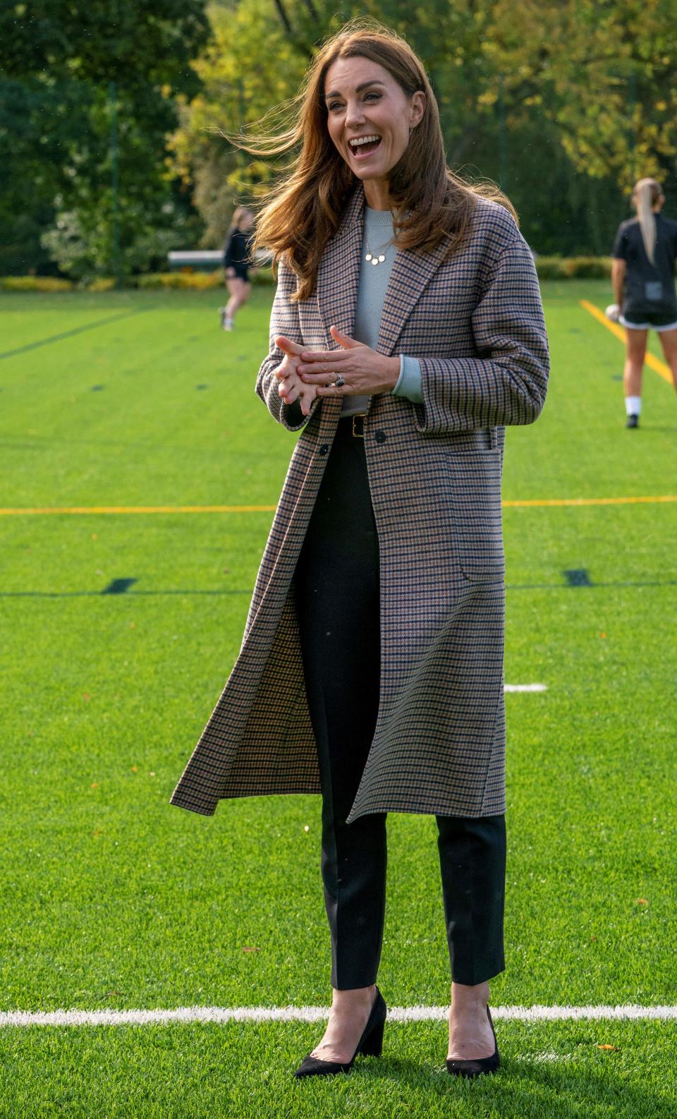 Britain's Catherine, Duchess of Cambridge gestures as she chats with staff and edwardsstudents during her visit to the University of Derby in Derby, central England, on October 6, 2020, where she met students to hear how the novel coronavirus COVID-19 pandemic has impacted university life, and what national measures have been put in place to support student mental health. (Photo by Arthur EDWARDS / various sources / AFP) (Photo by ARTHUR EDWARDS/AFP via Getty Images)