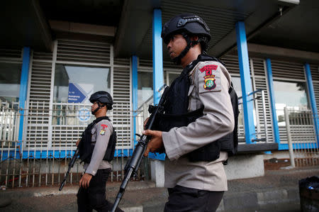 Police patrol near the scene of an explosion at a bus station in Kampung Melayu, Jakarta, Indonesia May 25, 2017. REUTERS/Darren Whiteside