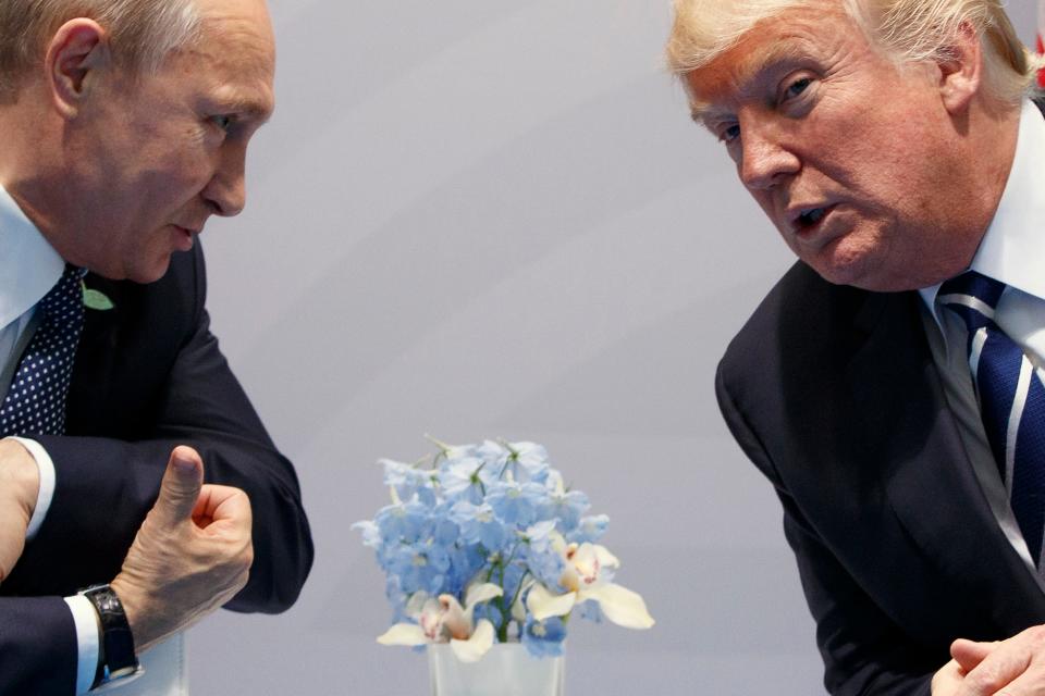 Former U.S. President Donald Trump, right, meets with Russian President Vladimir Putin at the G20 Summit in Hamburg, Germany, on July 7, 2017.