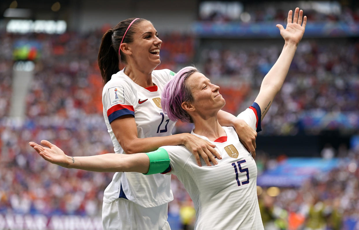 USA's Megan Rapinoe (right) celebrates scoring her side's first goal of the game from the penalty spot with team-mate Alex Morgan (top) USA v Netherlands - FIFA Women's World Cup 2019 - Final - Stade de Lyon 07-07-2019 . (Photo by  John Walton/EMPICS/PA Images via Getty Images)