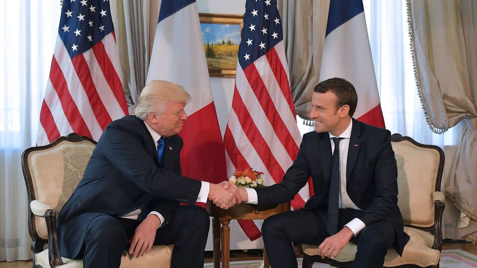 The infamous lengthy handshake between then-US President Donald Trump and French President Emmanuel Macron on the sidelines of the NATO summit, in Brussels, 2017. - Mandel Ngan/AFP/Getty Images