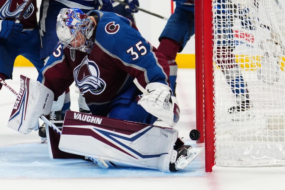 Colorado Avalanche goaltender Darcy Kuemper (35) let's the puck slip past for a goal by Tampa Bay Lightning left wing Ondrej Palat during the third period in Game 5 of the NHL hockey Stanley Cup Final, Friday, June 24, 2022, in Denver. (AP Photo/Jack Dempsey)