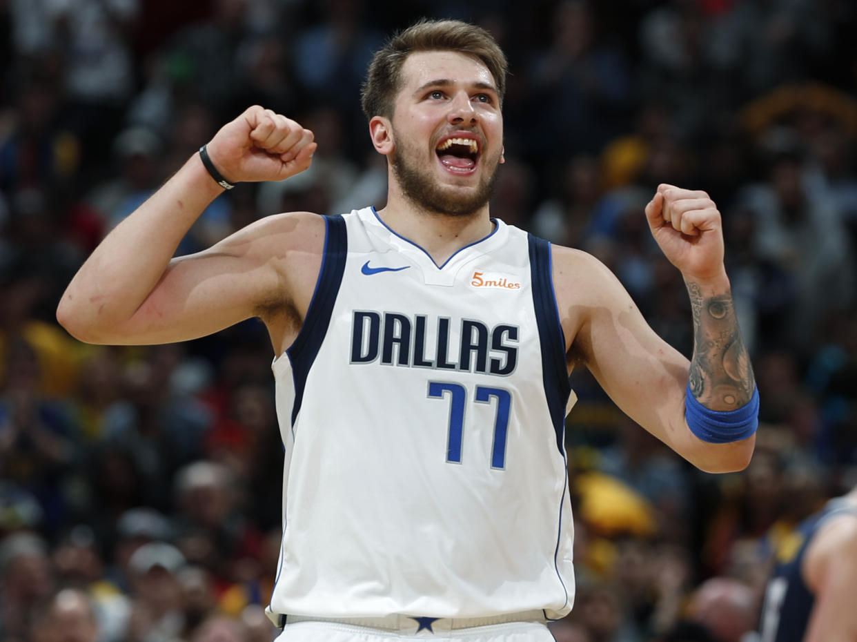 Dallas Mavericks forward Luka Doncic reacts after missing a foul shot late in the second half of the team's NBA basketball game against the Denver Nuggets on Thursday, March 14, 2019, in Denver. The Nuggets won 100-99. (AP Photo/David Zalubowski)