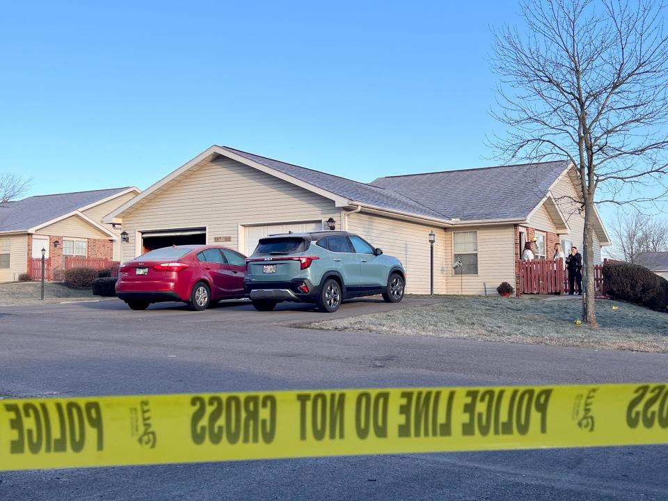 Law enforcement officers on Monday investigate a crime scene on the 1000 block of Landings Court in Ontario, where a city police officer and a 43-year-old domestic violence victim were shot Sunday night, leading to a four-hour standoff before the gunman surrended.