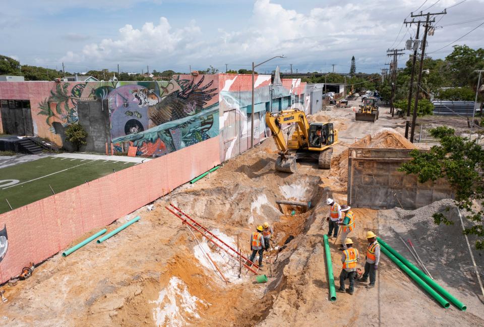 Construction crews work along North Railroad Avenue which will be home to the Nora, a $1 billion dining, business and residential district north of downtown West Palm Beach.
