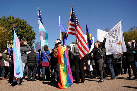 Transgender rights activists protest the government’s alleged attempt to strip transgender people of official recognition at the White House in Washington, U.S., October 22, 2018. REUTERS/Kevin Lamarque