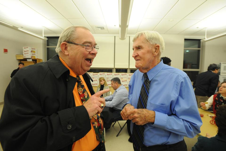 Former Taunton City Councilor and former Superintendent of Schools Gerald Croteau, left, chats with Peter Corr at Corr's last meeting as a Taunton School Committee member on Dec. 20, 2017.