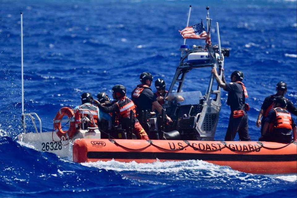 Once a Coast Guard ship could be rerouted to them, the boaters were rescued and safely brought aboard. U.S. Coast Guard