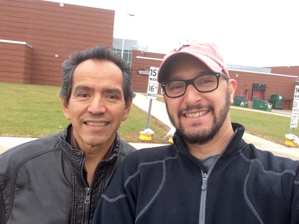 Carlos Muñoz Sr. of Fond du Lac and his son, Carlos Jr., stand outside Fond du Lac High School on Election Day in 2014, where the father cast his first ballot as an American citizen.