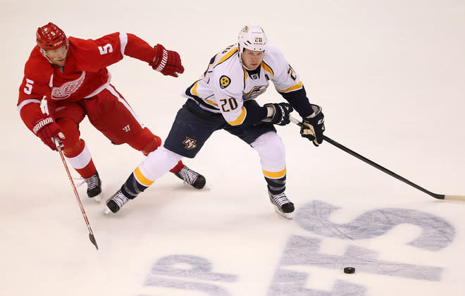  Ryan Suter #20 Of The Nashville Predators Tries To Get Around The Stick Of Nicklas Lidstrom #5 Of The Detroit Red Getty Images