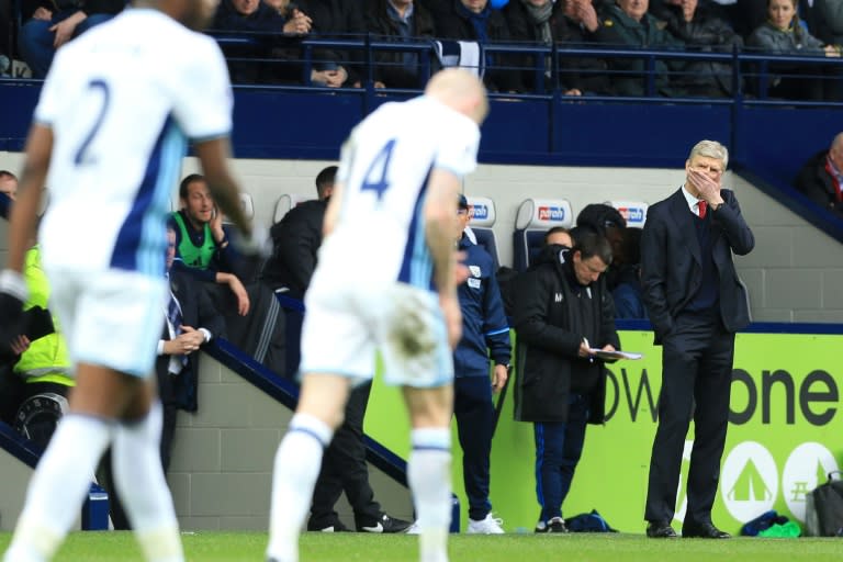 Arsenal's manager Arsene Wenger (R) reacts during their English Premier League match against West Bromwich Albion, at The Hawthorns stadium in West Bromwich, on March 18, 2017