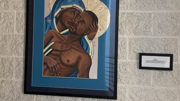 A painting titled “Mama” depicting George Floyd being comforted by the Virgin Mary has been criticized as sacrilegious by some at Catholic University of American in Washington D.C. (Credit: Change.org)