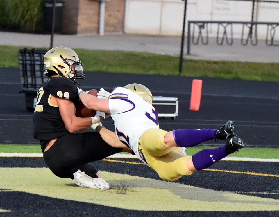 Corning's James Freeman catches a touchdown pass as Syracuse CBA's Riley Clemons-Butenko defends during CBA's 49-40 win in football Sept. 15, 2023 at Corning Memorial Stadium.