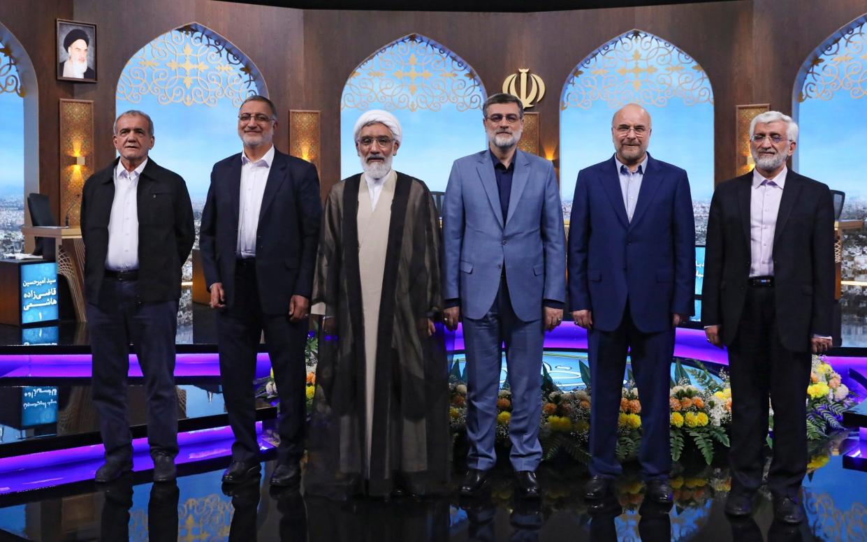 A row of men standing in an elaborately-decorated TV studio