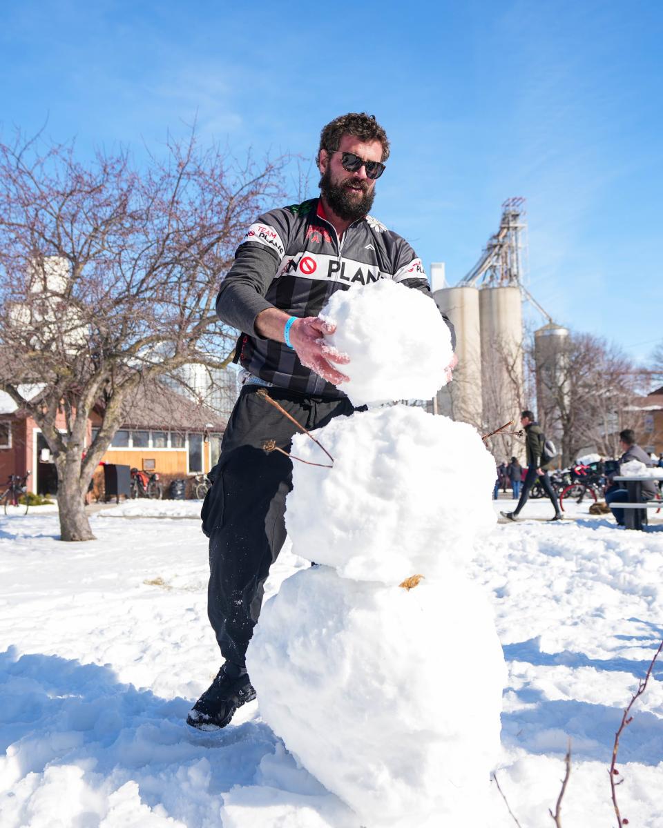 Bryan Holst, of Fort Dodge, makes a snowman in Rippey during the 46th Annual BRR Ride this year.