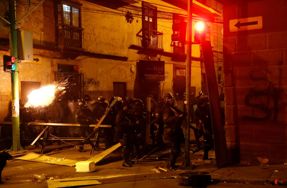 Police fire a weapon during clashes between protesters against Bolivia's President Evo Morales and government supporters, in La Paz, Bolivia Nov. 7, 2019. (Photo: Kai Pfaffenbach/Reuters)