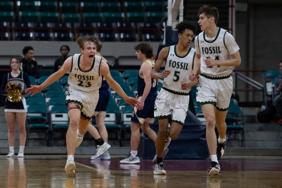 Fossil Ridge's Domenic Leone, left, celebrates after scoring against Legacy with teammates Pryce Wyatt and Colin Hayes during the 5A Great 8 at the Denver Coliseum on Saturday, March 5, 2022.