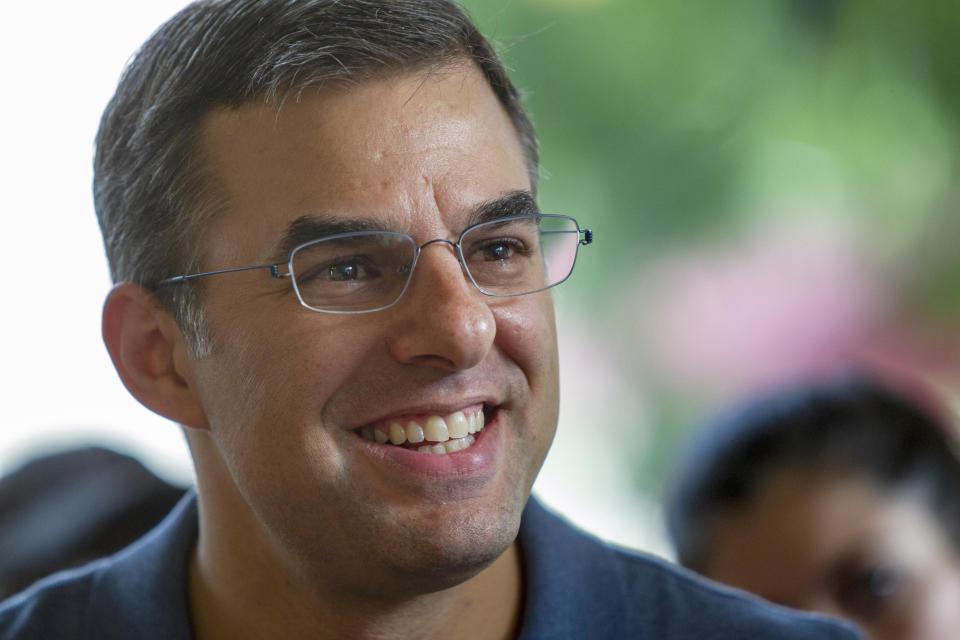 U.S. Rep. Justin Amash, I-Cascade Township, holds a constituent meeting in Grand Rapids in 2019.
