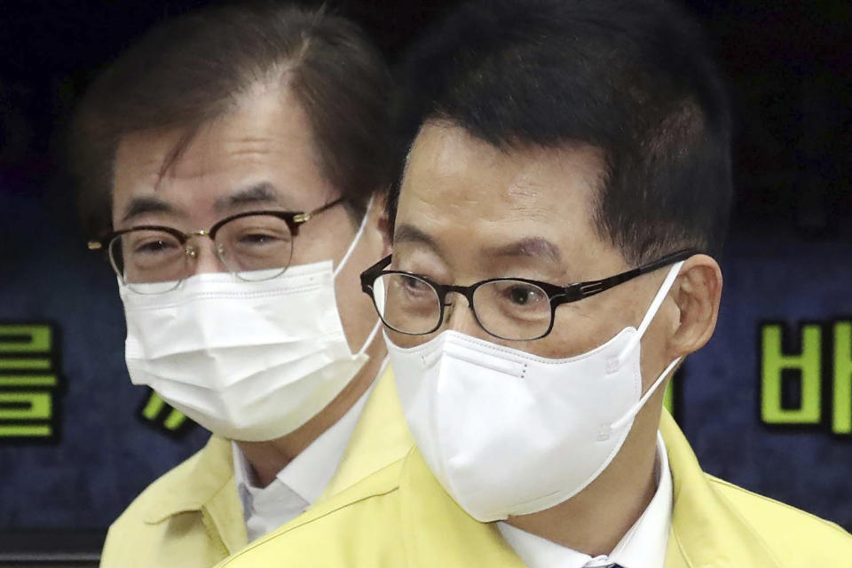 Suh Hoon, left, then the chief of the National Security Office and Park Jie-won, right, then the director of the National Intelligence Service, arrive to attend a meeting at the government complex in Seoul, South Korea, Feb. 3, 2021. (Korea Pool/Newsis via AP)