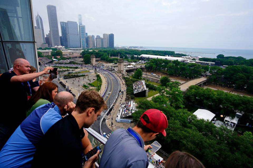 Fans watch as cars race along Grant Park during the NASCAR Cup Series race Sunday in downtown Chicago.