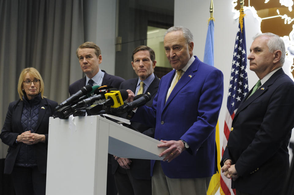 Left to right: Sen. Maggie Hassan, D-N.H., Sen. Michael Bennet, D-Colo., Sen. Richard Blumenthal., D-Conn., Charles Schumer, D-N.Y. and Sen. Jack Reed, D-R.I. answer media questions in Lviv, Ukraine, Friday, Feb. 23, 2024. (AP Photo/Mykola Tys)