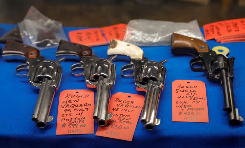 Guns are displayed in a case at Master Class Shooting Range in Monroe, New York