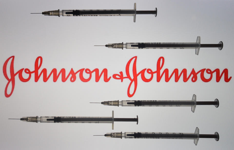 An illustrative image of medical syringes in front of Johnson and Johnson logo displayed on a screen. On Friday, January 8, 2020, in Dublin, Ireland. (Photo by Artur Widak/NurPhoto via Getty Images)