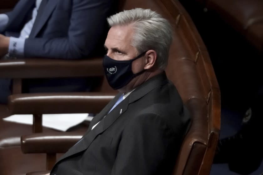 House Minority Leader Kevin McCarthy, R-Calif., looks on in the House Chamber after they reconvened for arguments over the objection of certifying Arizona's Electoral College votes in November's election, at the Capitol in Washington, Wednesday, Jan. 6, 2021. (Greg Nash/Pool via AP)