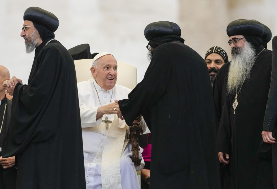 Pope Francis greets Coptic religious leaders during his weekly general audience in St. Peter's Square at The Vatican, Wednesday, May 10, 2023. (AP Photo/Alessandra Tarantino)