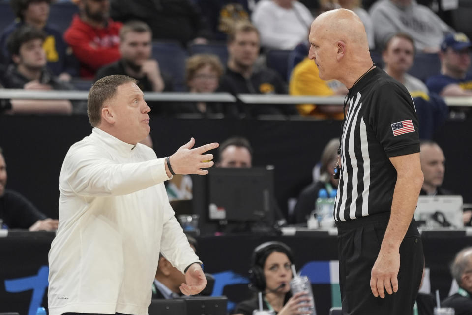 Penn State coach Mike Rhoades gestures to a referee during the first half of the team's NCAA college basketball game against Michigan in the first round of the Big Ten Conference men's tournament Wednesday, March 13, 2024, in Minneapolis. (AP Photo/Abbie Parr)