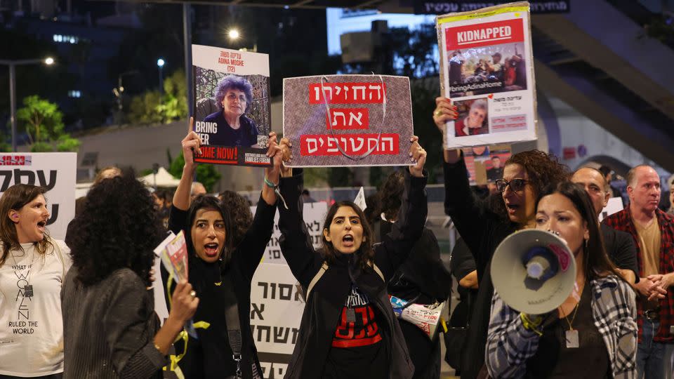 Families and friends of hostages held in Gaza call for Israeli Prime Minister Benjamin Netanyahu to bring them home, during a demonstration in Tel Aviv on November 21. - Ahmad Gharabli/AFP/Getty Images
