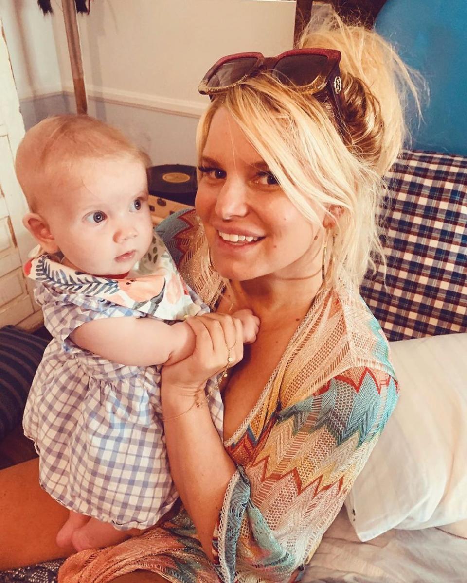 Jessica Simpson poses with her baby