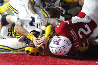 Michigan quarterback J.J. McCarthy (9) scores a touchdown against Rutgers defensive back Avery Young (2) during the first half of an NCAA college football game, Saturday, Nov. 5, 2022 in Piscataway, N.J. (AP Photo/Noah K. Murray)