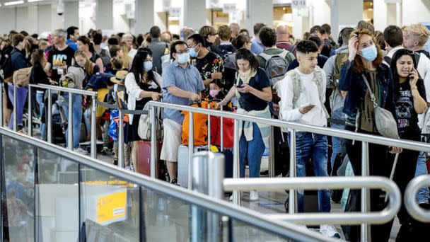 PHOTO: Travelers line up at the airport in Schiphol, Netherlands, on July 9, 2022. (ANP via ZUMA Press)