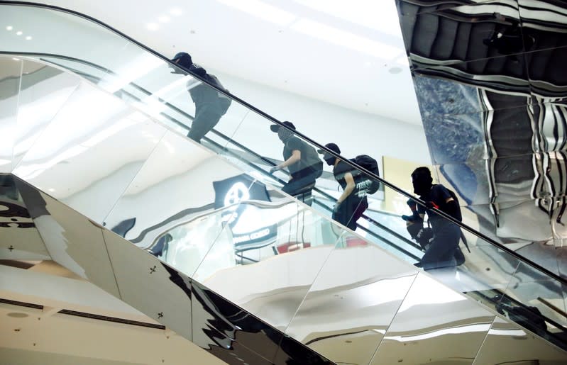 Protesters are seen at Festival Walk mall in Kowloon Tong, Hong Kong