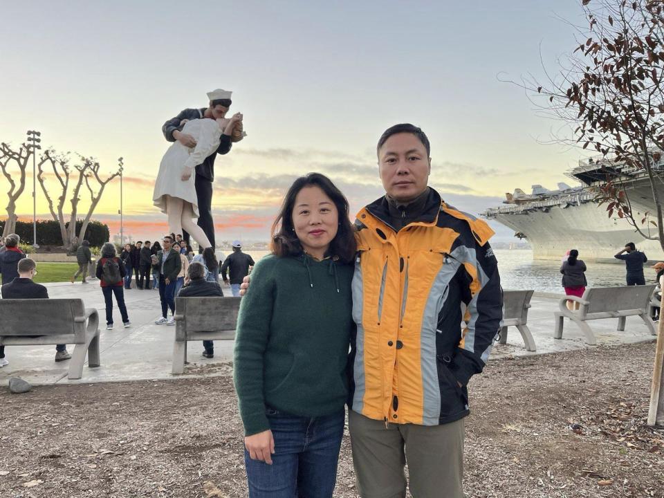 This undated handout photo released by Safeguard Defenders shows Chinese dissident Liu Sifang and his wife Lu Lina in the United States. When her husband fled China in 2019 to escape a police crackdown on dissidents, Lu Lina thought she and their young son could soon join him in safety abroad. She did not know that she would be forced to move house, that her 8-year-old son would be effectively kicked out of school and that border police would block her from leaving the country over the next three years. In the end, the couple had to resort to filing for divorce in China to get around the exit ban. (Safeguard Defenders via AP)