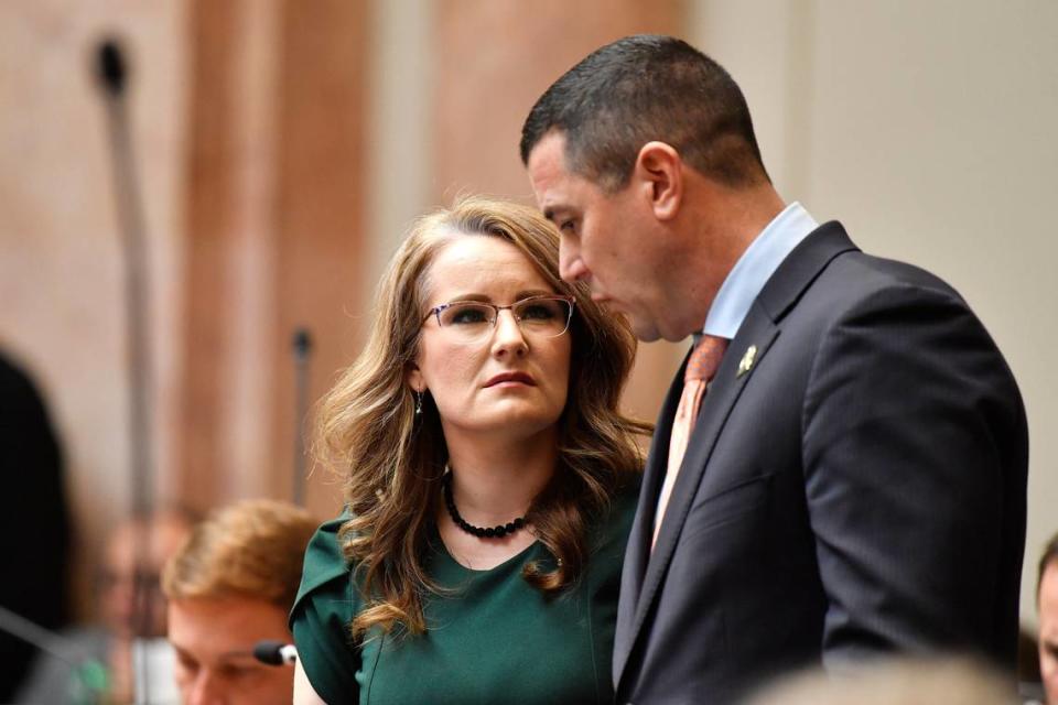 Kentucky House of Representatives members Savannah Maddox, left, speaks with Representative David Meade about Senate Bill 150 at the Kentucky House of Representatives in Frankfort, Ky., Thursday, March 16, 2023. (AP Photo/Timothy D. Easley)