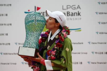 Golf - LPGA KEB Hana Bank Championship - Incheon, South Korea - 16/10/16. Carlota Ciganda of Spain kisses the trophy after winning. REUTERS/Kim Hong-Ji