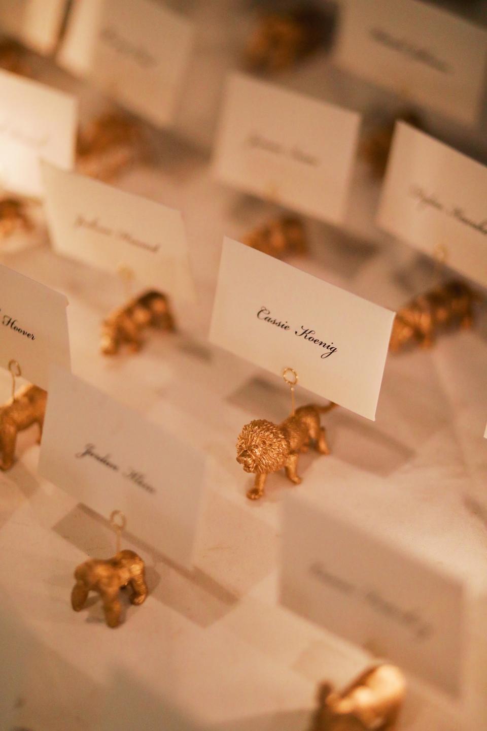 We used gold animal figurines to hold up everyone’s escort cards, and the table looked like a miniature stampede.